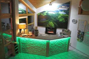 a room with a large aquarium on the wall at Appartement In Schalkenmehren Mit Schönem Balkon in Schalkenmehren