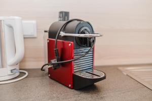 a red and black mixer sitting on a counter at Pension Bacherhof in Mariapfarr