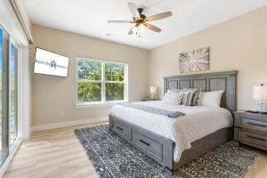 a bedroom with a bed and a ceiling fan at Lake Taneycomo Views-Near Branson Landing-Cmty Outdoor Pool-Free Tickets-Elevator! in Branson +30 photos
