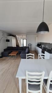 a white table and chairs in a living room at Two-story four-room apartment in Copenhagen +57 photos