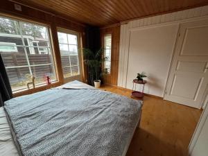 Postel nebo postele na pokoji v ubytování Lakecottage