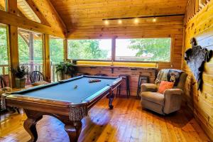 a billiard room with a pool table in a cabin at Cozy Cabin Wgame Room, Hot Tub & Creek in Pigeon Forge