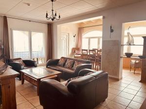a living room with couches and a table at Casa Mas Tomasi Pals in Pals