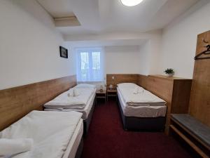 Postel nebo postele na pokoji v ubytování Penzion U Cyrila