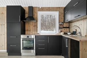 Kuchyň nebo kuchyňský kout v ubytování Modernized standalone cabin Sørreisa - Bardufoss