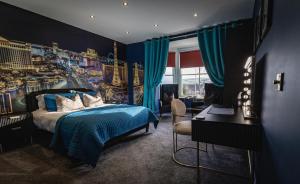 a bedroom with a bed and a desk in a room at St Hildas Complex in Hinderwell +37 photos