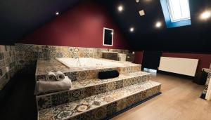 a bathroom with a bath tub and a sink at St Hildas Complex in Hinderwell