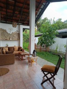 a living room with a couch and a table at Coco Mango Hostel in Dickwella
