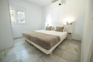 Posteľ alebo postele v izbe v ubytovaní Gran villa con vistas al mar y piscina privada