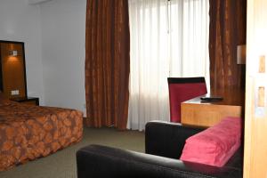 Postel nebo postele na pokoji v ubytování Hotel Bagoeira