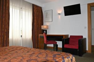 TV a/nebo společenská místnost v ubytování Hotel Bagoeira