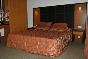 Postel nebo postele na pokoji v ubytování Hotel Bagoeira