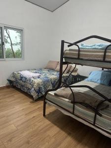 Postel nebo postele na pokoji v ubytování Villas San Francisco, Siguatepeque, Comayagua