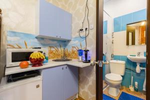 A kitchen or kitchenette at Adoriya Apartments