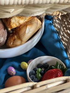 two plates of food and fruit on a table at Sams Cottage in Roermond
