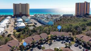 an aerial view of a resort near the ocean at 5 minutes walk to beach, Family Friendly condo with shared pool, tennis court in Panama City Beach