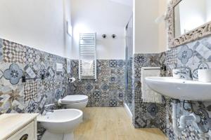 a bathroom with a sink and a toilet at Casa Lydia in Rio nellʼElba +17 photos