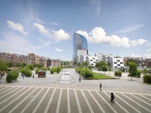 a large plaza in a city with a tall building at Miracle Luxury Property Liège Guillemins in Liège