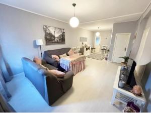 a living room with a couch and a table at La Casita de Ronda in Ronda