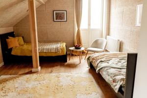 Postel nebo postele na pokoji v ubytování Pērlerada room