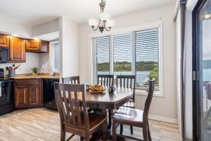 a kitchen and dining room with a table and chairs at Moor Fun in Kimberling City