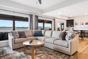 a living room with a couch and a table at Over the Top in Hollister
