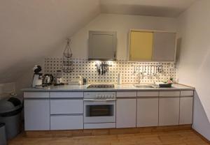 Η κουζίνα ή μικρή κουζίνα στο Bright Apartment with HomeGym