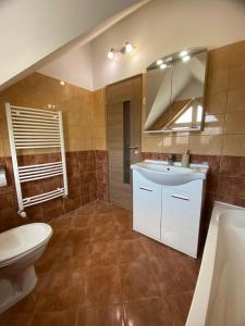 Koupelna v ubytování Korall Apartman