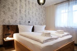 En eller flere senge i et værelse på Binnendiek Haus 4 Apartment 5 + 23 billeder