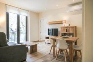 Televízia a/alebo spoločenská miestnosť v ubytovaní Can Cintet 1- Apartamento en la plaza de Besalú