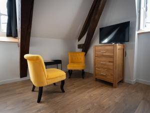 TV a/nebo společenská místnost v ubytování Chambres d'Hôtes Gaïnaa
