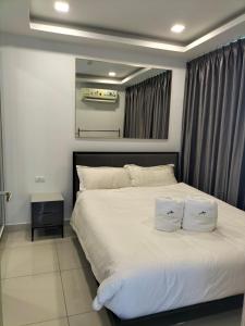 Ένα ή περισσότερα κρεβάτια σε δωμάτιο στο Arcadia beach continental +3 φωτογραφίες