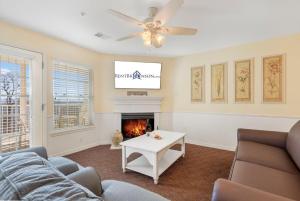 a living room with a couch and a fireplace at Ozark Vista 129 in Kimberling City