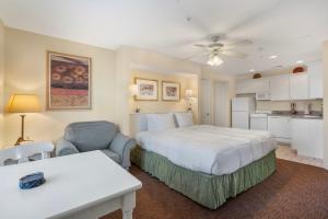 a hotel room with a bed and a kitchen at Ozark Vista 129 in Kimberling City +52 photos
