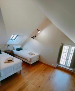 Postel nebo postele na pokoji v ubytování Domaine du Manoir de Vains