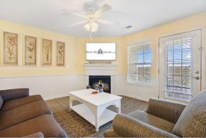 a living room with two couches and a fireplace at Large 2 Bed Condo w Beautiful Deck Views-Free Attraction Tickets-Table Rock Lake Access in Kimberling City