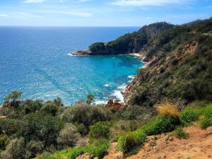 a view of the ocean from a hill at Apartament Sant Feliu de Guíxols downtown in Sant Feliu de Guixols