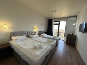 Letto o letti in una camera di Majestic