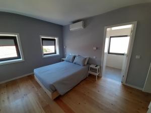 Ένα ή περισσότερα κρεβάτια σε δωμάτιο στο Casa Azul