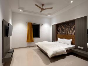 Postel nebo postele na pokoji v ubytování Mannat Resort