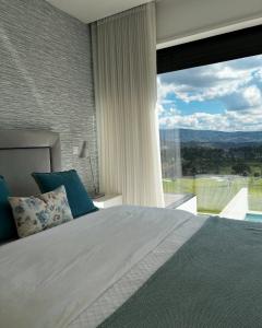 Giường trong phòng chung tại Moradia Vila Golfe +47 ảnh