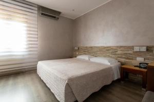 Postel nebo postele na pokoji v ubytování Hotel San Giorgio
