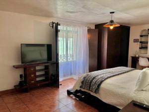 Hotel Boutique Casa Catalá客房内的一张或多张床位