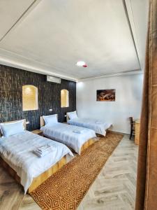 Palmiers Hôtel Club客房内的一张或多张床位