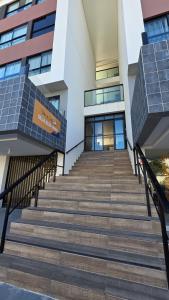 a set of stairs in front of a building at Villas do Porto Residence by La Playa in Porto De Galinhas