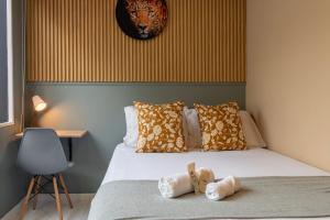 Postelja oz. postelje v sobi nastanitve Nomadia Coliving Boutique