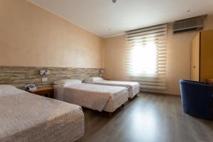 Postel nebo postele na pokoji v ubytování Hotel San Giorgio