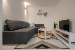 a living room with a couch and a table at Casa Dorado in Pontevedra