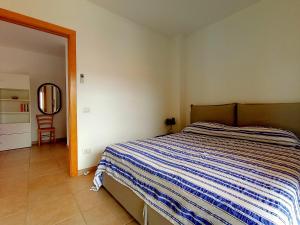 En eller flere senge i et værelse på Miki1 - con piscina e campo da tennis