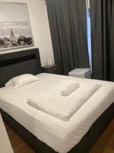 Postel nebo postele na pokoji v ubytování Lindis Hotel